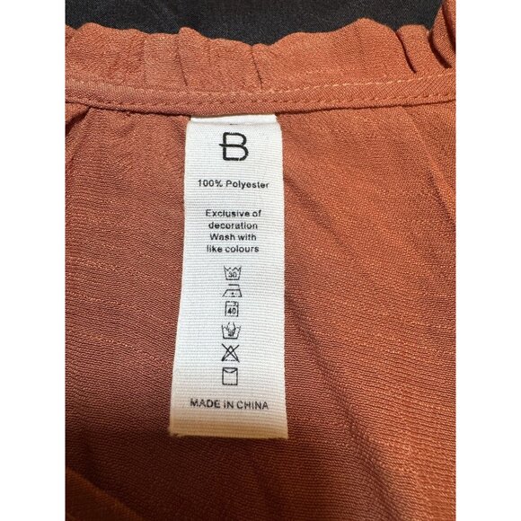 Rust Orange Long-Sleeve Blouse With Ruffle Neckline &‎ Smocked Cuffs - Picture 2 of 5